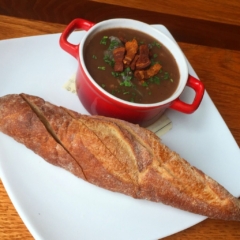 escargot in red wine sauce with bacon by Chef Lynn Wheeler