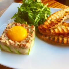 beef tartare arugula salad raw egg yolk cucumber grilled baguette by Chef Lynn Wheeler