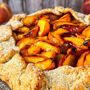 Rustic peach galette with flaky golden crust and fresh peach filling